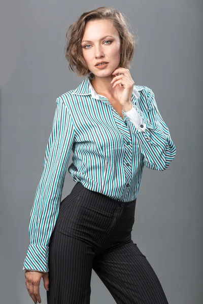 Beautiful  woman in shirt and trousers — Stock Photo, Image