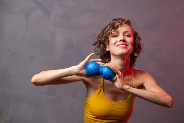 Woman with yoga props tools. Muscular fascial warm-up. Myofascial release