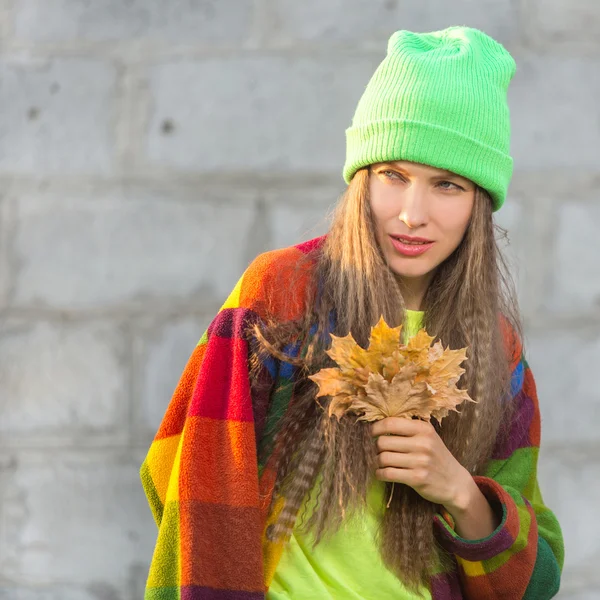 Beauty autumn woman over grunge grey wall — Stock Photo, Image