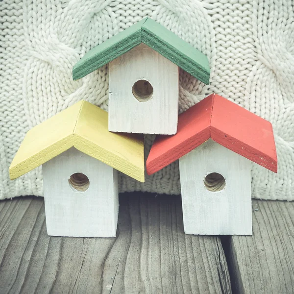 Colorful birdhouses on rustic background — Stock Photo, Image