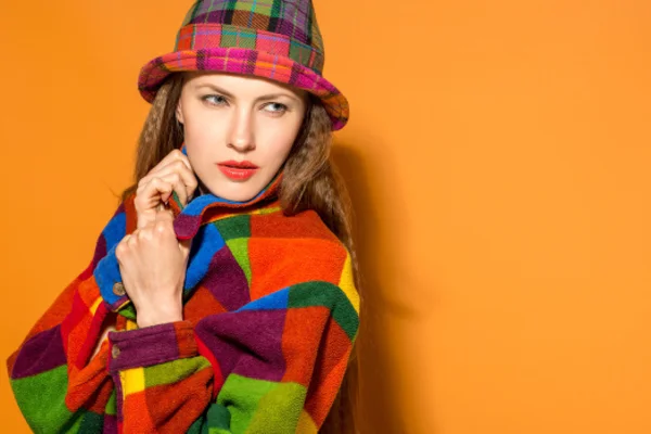 Autumn woman over bright orange background — Stock Photo, Image