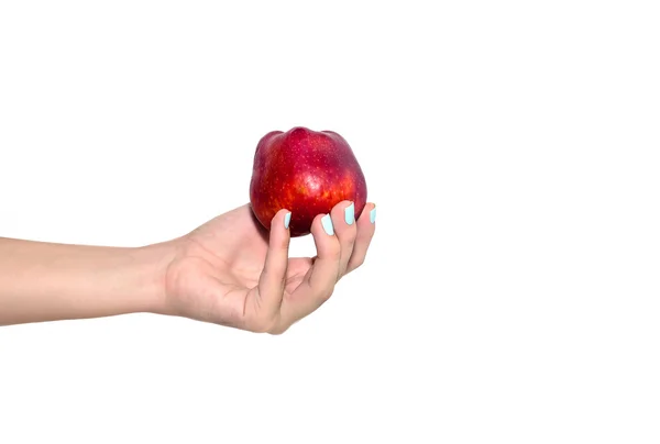 Roter Apfel in der Hand der Frau — Stockfoto