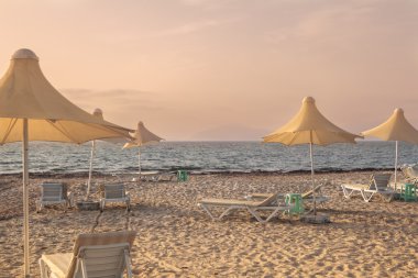 Mediterranean beach during sunset on Kos island clipart