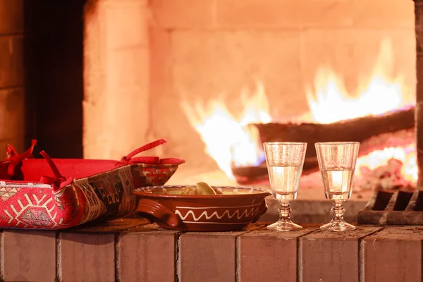 Two glasses of vodka at firewood oven background — Stock Photo, Image