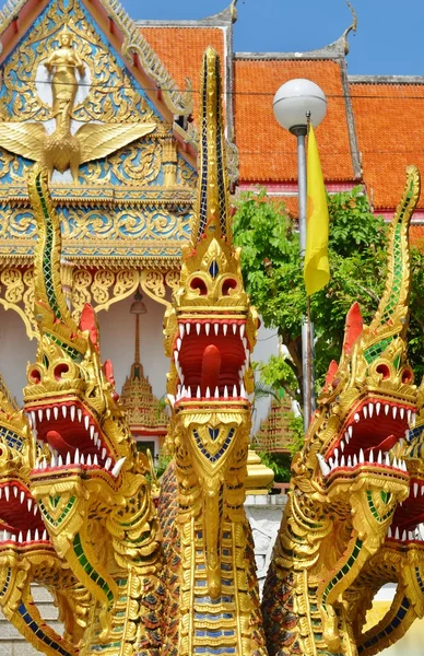 Gold half snake, half-dragons decorating Naga staircase to Wat Wichit Sangkaram, Phuket, Thailand — Stock Photo, Image