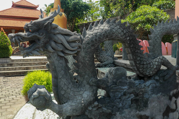 Sculpture of dragon in budhist temple Brahma Vihara-Arama Banjar in Lovina, Indonesia, Bali.