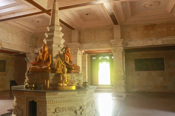 Golden Buddha in the Buddhist temple Brahma Vihara Arama, Bali, Indonesia. Yellow Buddha look beautiful — Stock Photo, Image