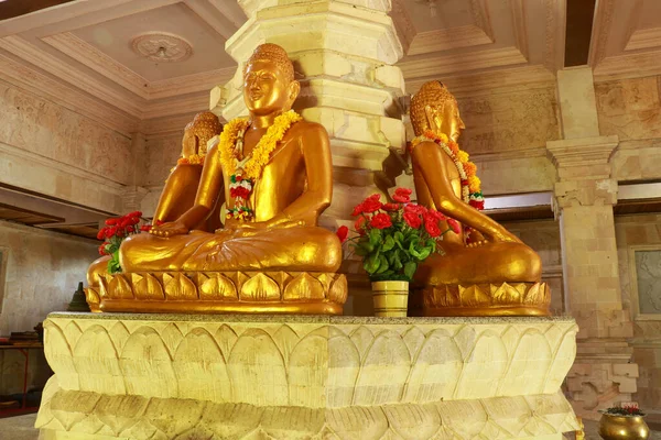 Golden Buddha in the Buddhist temple Brahma Vihara Arama, Bali, Indonesia. Yellow Buddha look beautiful — Stock Photo, Image