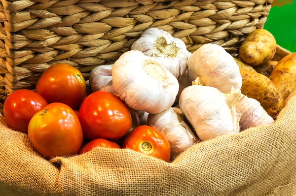 Tomato garlic and potato on a sack — Stock Photo, Image