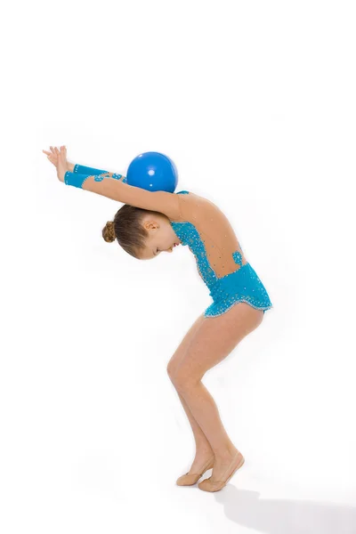 Girl gymnast on a white background with a ball — Stock Photo, Image