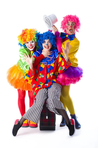 Tre buffo clown colorato su uno sfondo bianco — Foto Stock