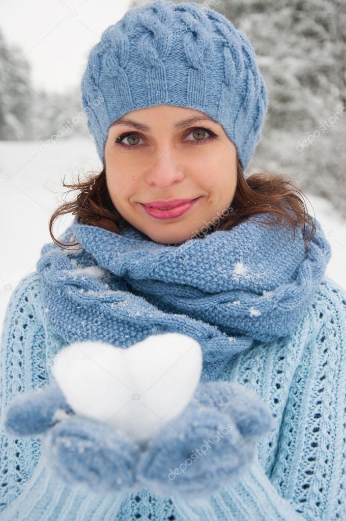 winter portrait of the beautiful young woman 