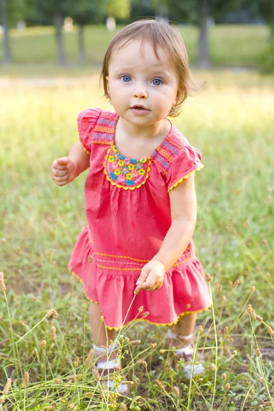 One-year-old girl on walk in park — Stok fotoğraf