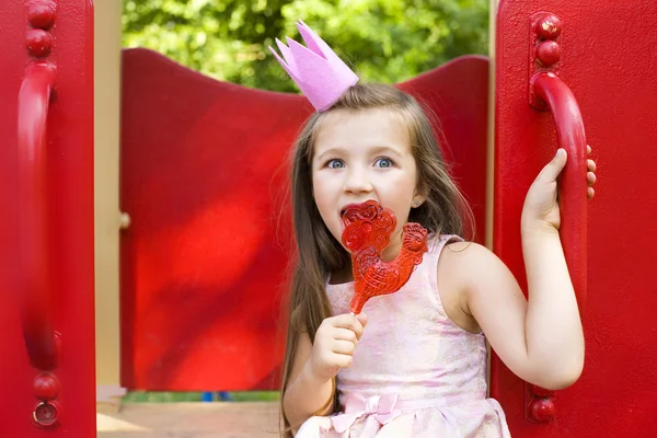 Princess licking a lollipop — Stock Photo, Image