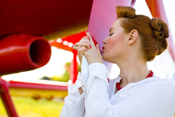 Pin-up girl and red plane — Stock Photo, Image