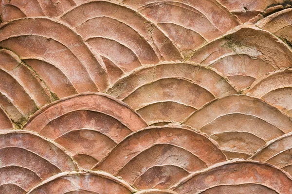 Closeup old orange fish scales pattern on the wall texture backg — Stock Photo, Image