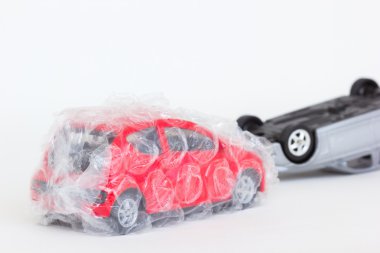 horizontal photo of two cars toy in accident scene. The safe red clipart