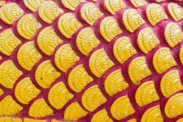 Sculpture of golden dragon scale or Fish scale textures in Thai — Stock Photo, Image