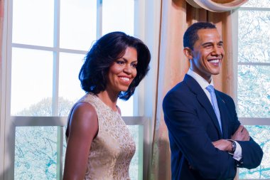 BANGKOK, THAILAND - DECEMBER 19: A waxwork of Barack and Michelle Obama on display at Madame Tussauds on December 19, 2015 in Bangkok, Thailand clipart