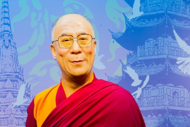 BANGKOK, THAILAND - DECEMBER 19: Wax figure of the famous Dalai Lama from Madame Tussauds on December 19, 2015 in Bangkok, Thailand. clipart