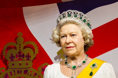 BANGKOK, THAILAND - DECEMBER 19: Wax figure of the famous Queen Elizabeth from Madame Tussauds on December 19, 2015 in Bangkok, Thailand clipart