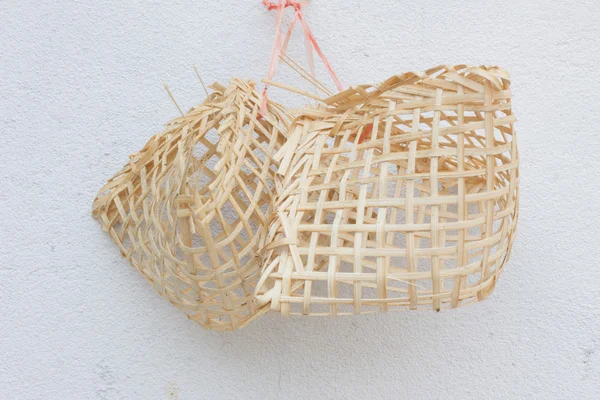 Small wooden birdcages on the white wall — Stock Photo, Image