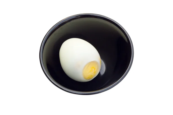 Boiled egg in black bowl isolated on white background — Stock Photo, Image