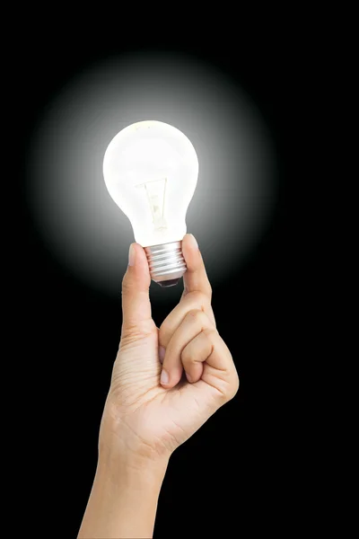 Hand holding light bulb symbolizing help, idea or inspiration — Stock Photo, Image