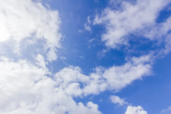 Blue sky background with some clouds — Stock Photo, Image