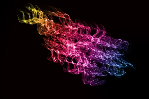 Abstract colorful smoke isolated on black background — Stock Photo, Image