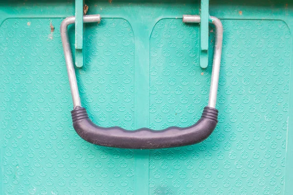 Old black handle of green bucket, closeup — Stock Photo, Image