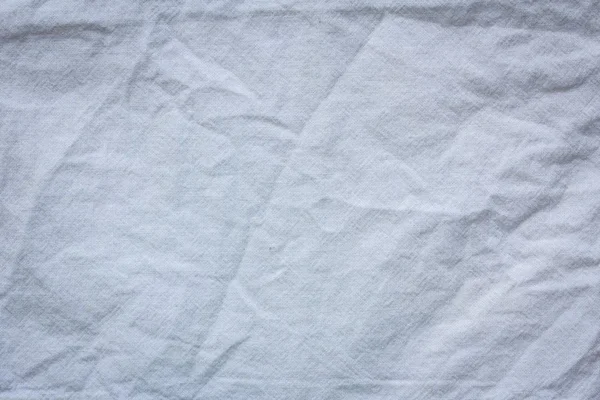 Fondo de textura textil de tela arrugada blanca — Foto de Stock