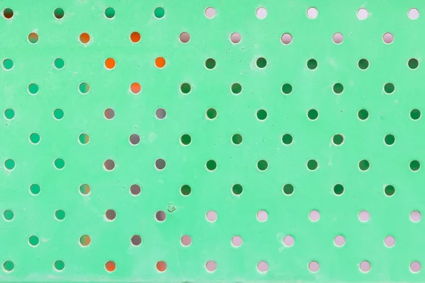 Textuur van vuile groene metaal met gaten — Stockfoto
