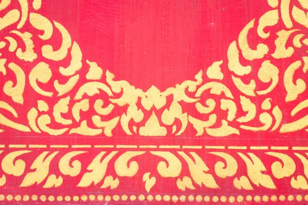 Abstracte gouden patroon op rode muur — Stockfoto