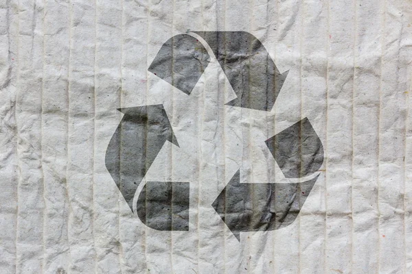 Recycle logotyp på gamla papper — Stockfoto