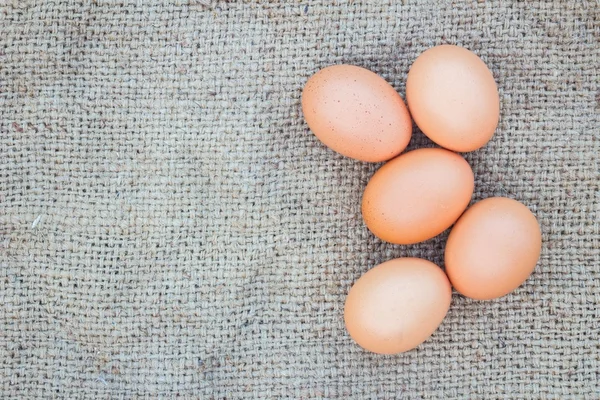 Eggs on gunnysack — Stock Photo, Image