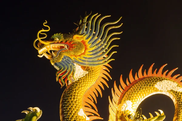 Chinese style dragon statue dragon at night, in Thailand. — Stock Photo, Image