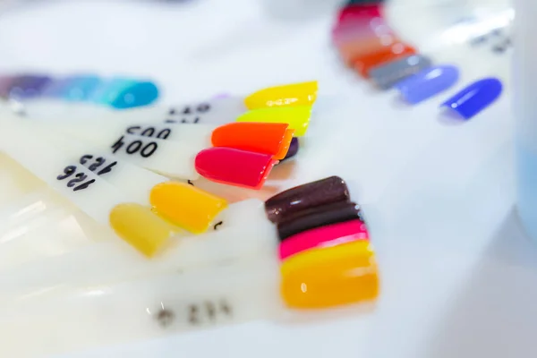 Lot Samples Multicolored Nail Polish White Table — Stock Photo, Image