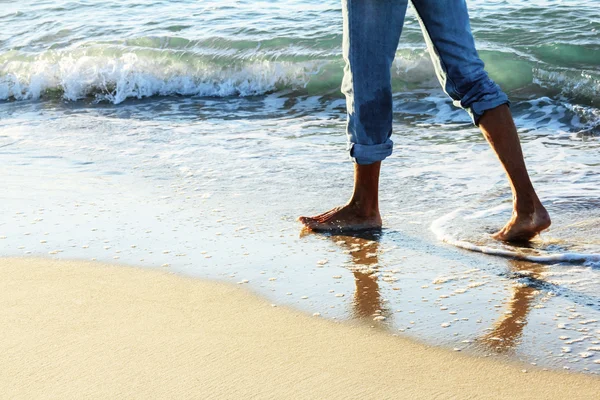 Man walking on a beach — Stock Photo, Image