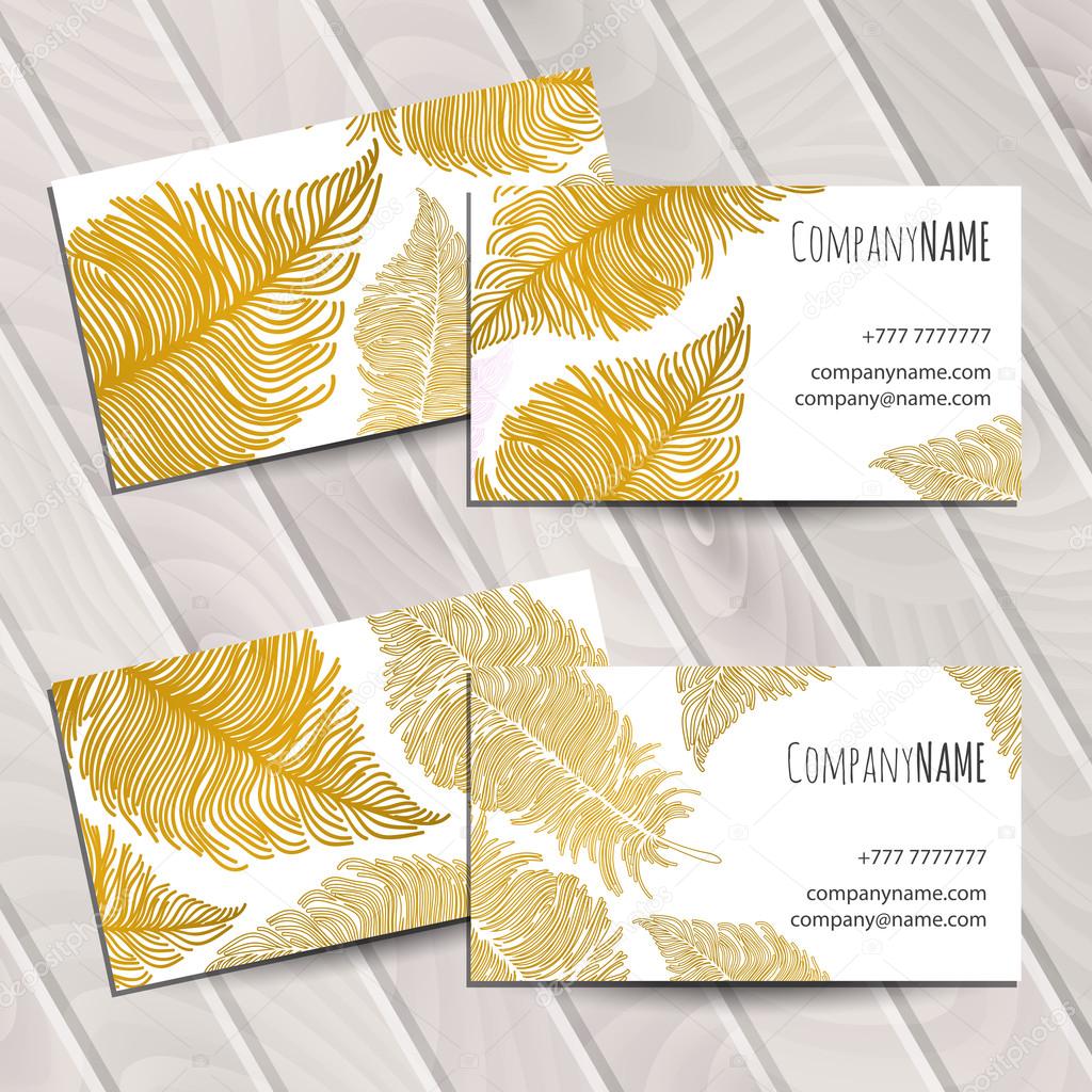 Business card with gold feathers