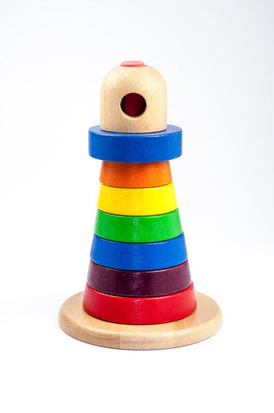 Toy pyramid build from colored wooden rings 
