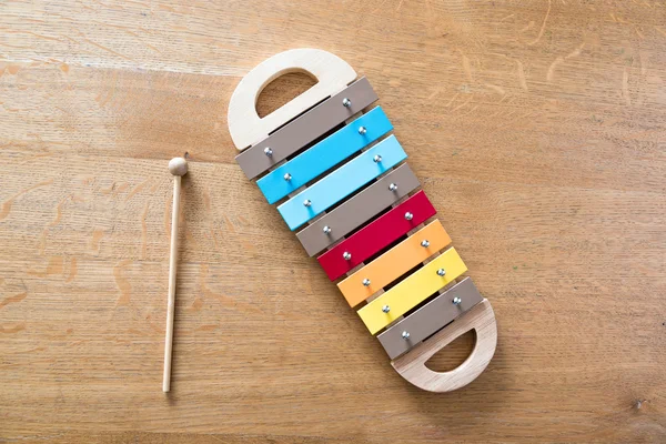 Mullticolored xylophone on a wooden background — Stock Photo, Image