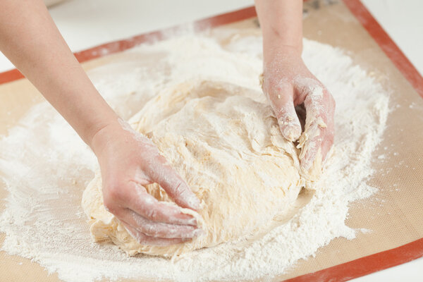 Making dough by hands at bakery