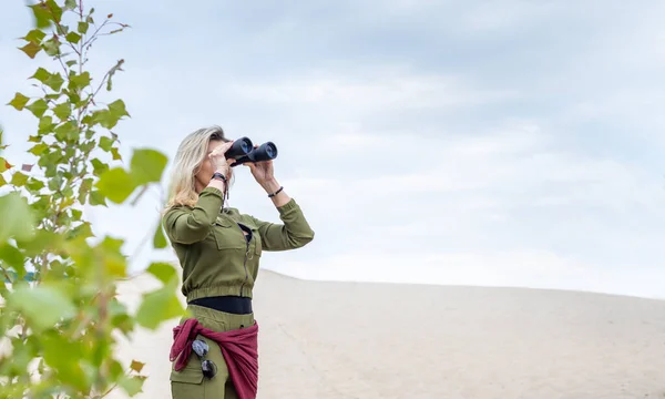 Woman Looks Binoculars Standing Nature Background Trees Sand — Stock Photo, Image