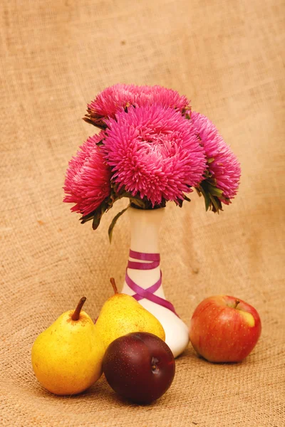 Arrangement of flowers and fruit