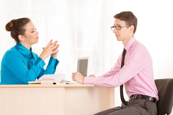 Two young business people having a conversation in the office — Stock Photo, Image