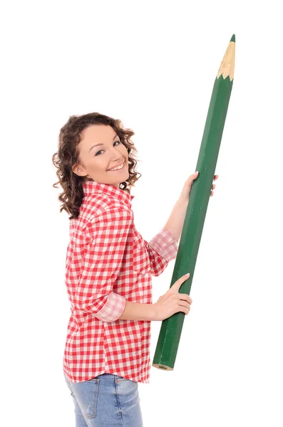 Young laughing woman with huge green pencil — Stock Photo, Image