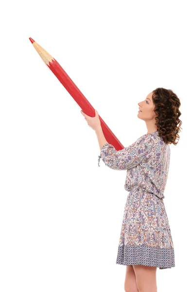 Young pretty woman with giant red pencil — Stock Photo, Image