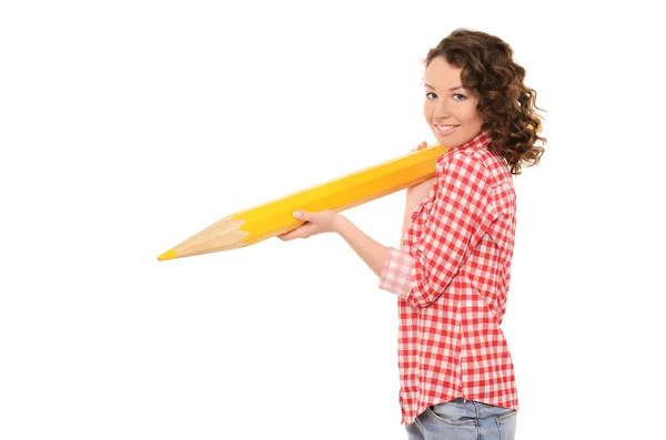 Jonge aantrekkelijke vrouw met grote gele potlood — Stockfoto