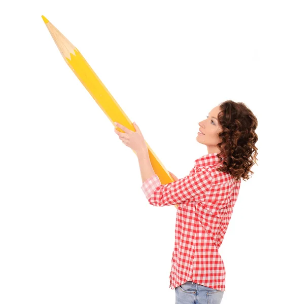 Young pretty woman with huge yellow pencil — Stock Photo, Image